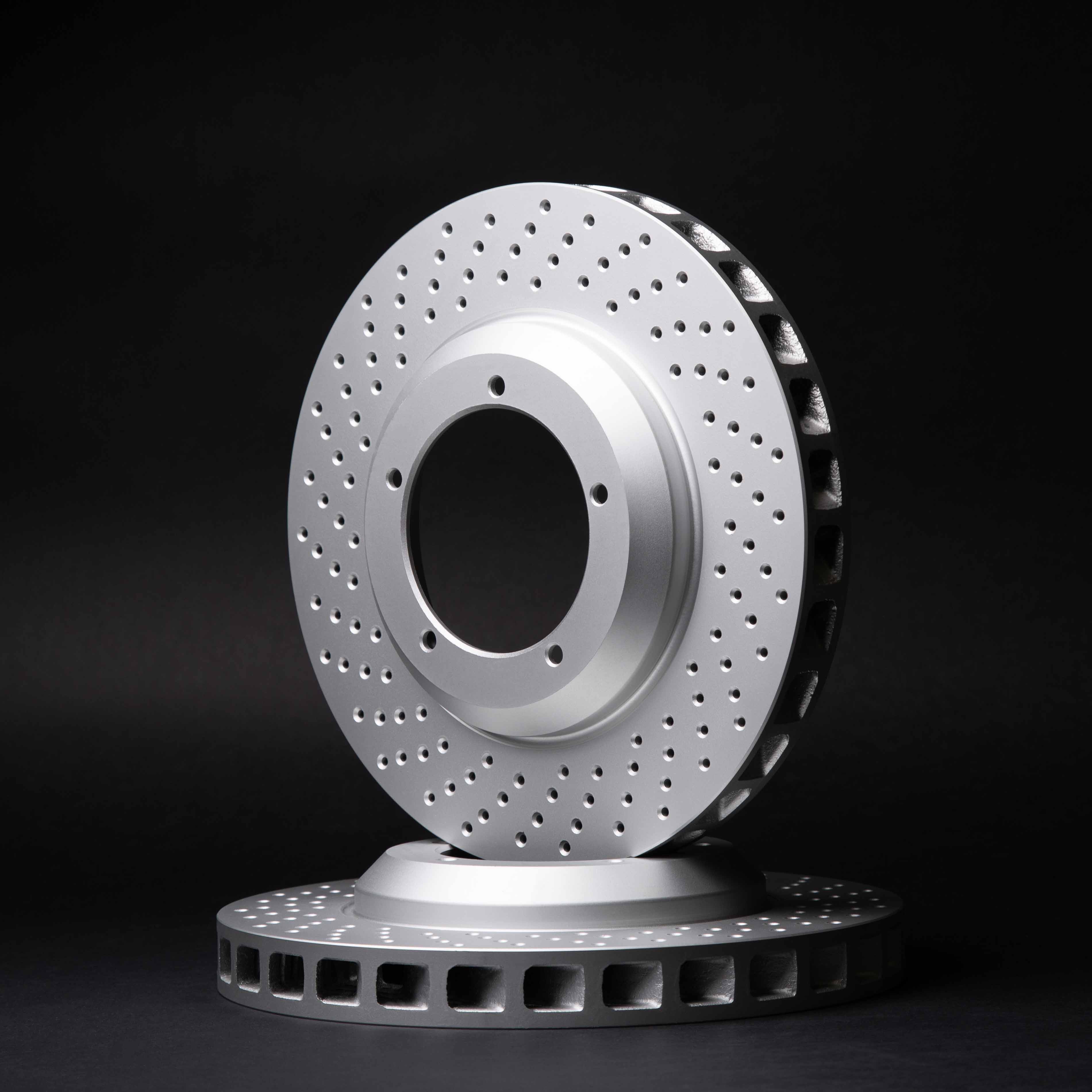 Drilled rotor standing on its pair, studio lit on black - Top Rotor Types for Toyota Corolla – Find the Perfect Fit