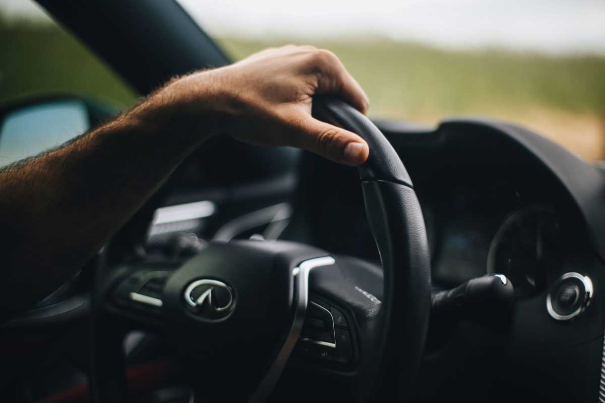 Driver hands on wheel